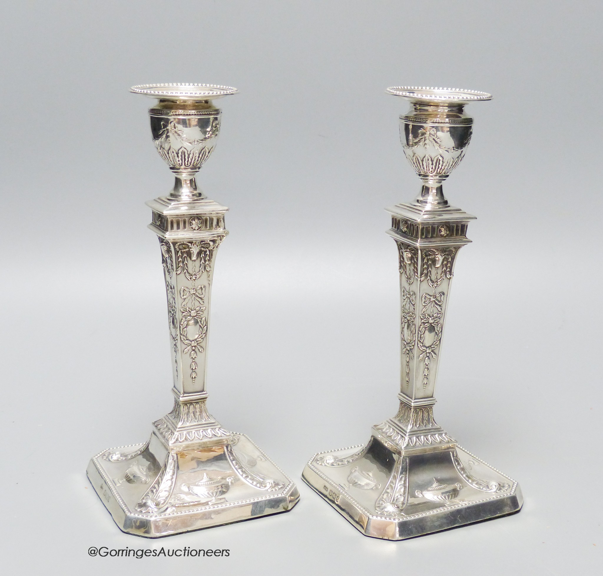 A pair of late Victorian Adams design silver candlesticks, Sheffield, 1898, 20cm, weighted.